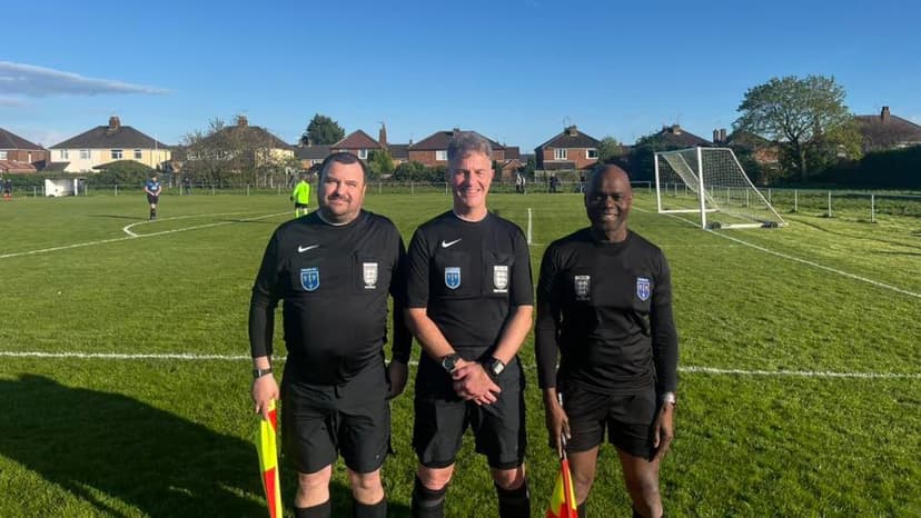 Group of officials on pitch